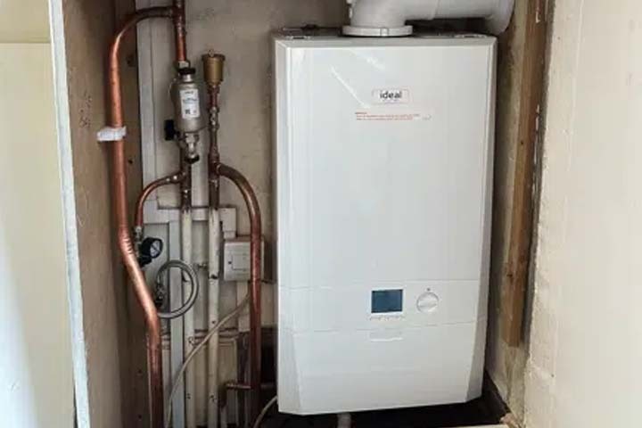 Illustration of an open vent boiler system showing water tank and pipe connections