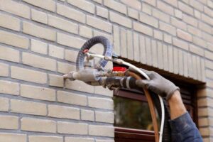 Cavity wall insulation in a UK home reducing heat loss, cutting energy bills, and improving overall heating efficiency.
