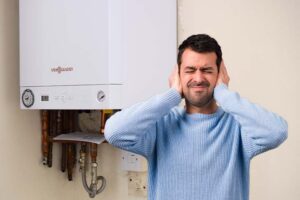 Boiler with loud vibrating noise in a UK home, showing signs of internal fault or loose parts needing repair