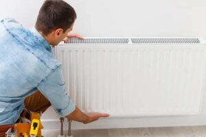 Close-up of radiator installation under ECO4 First Time Central Heating Grant