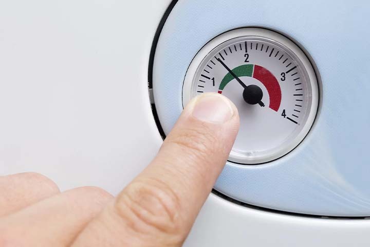 Boiler pressure gauge showing recommended pressure range for safe operation in a UK home heating system
